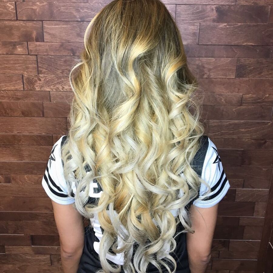 Long hair styled in big, defined curls