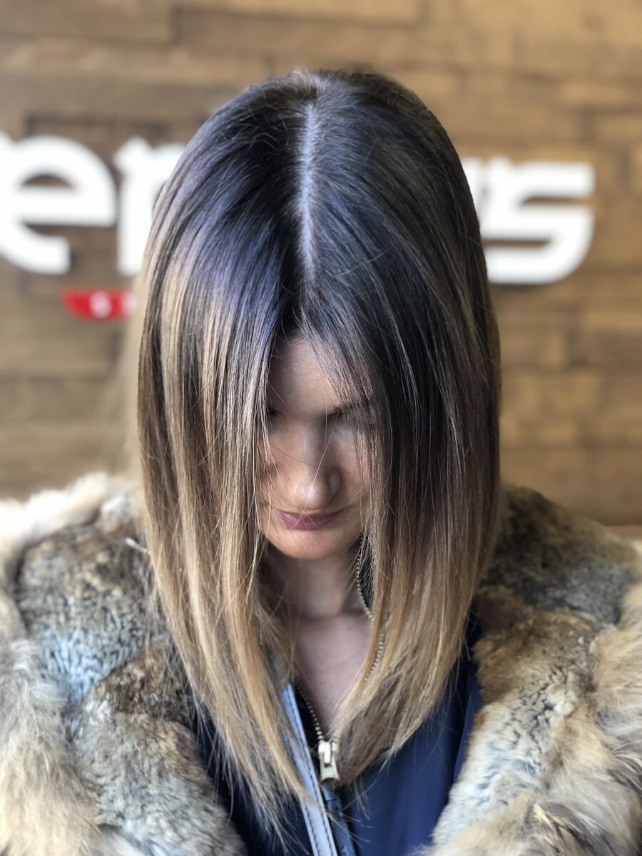Shoulder-length cut with a centre part and straight ends