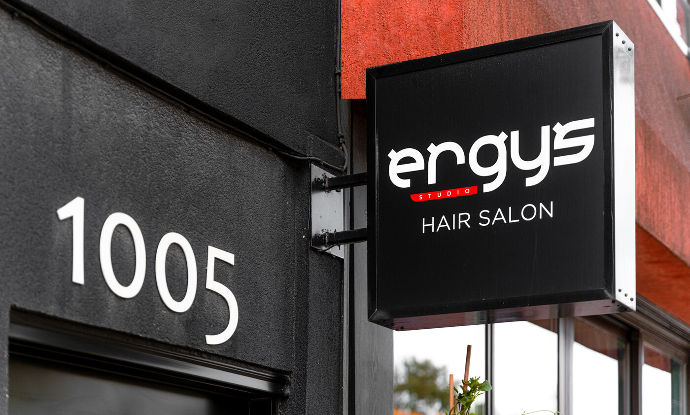 The Ergys Studio sign above number 1005 on Eglinton Ave W
