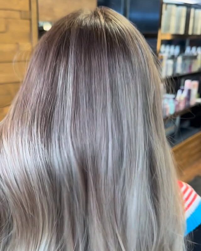 Ash blonde highlights blended from a darker root, by Dea