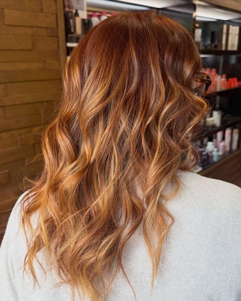 Copper hair colour on long waves, by Rosangela